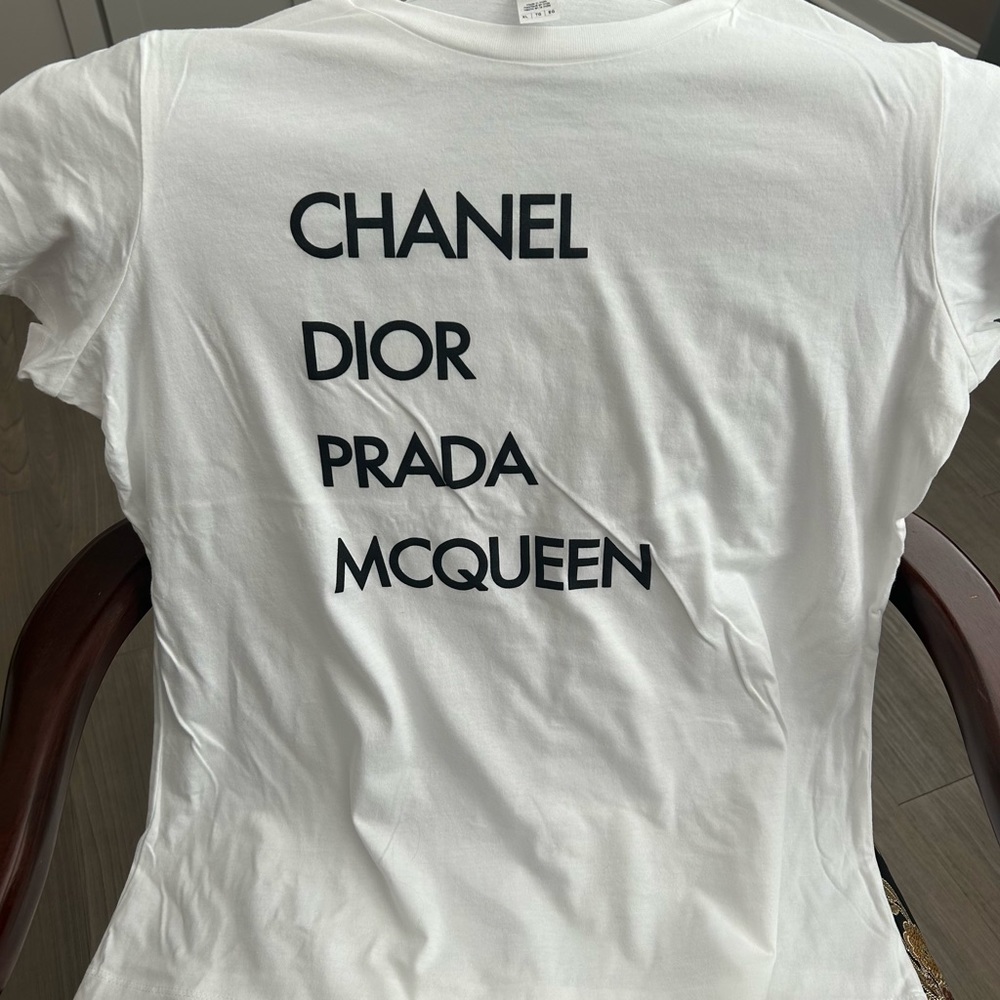 💯 cotton white tee with cap sleeves and Luxe brands screen printed on front